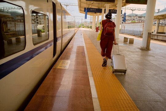 Traveling by Hu- Speed Train in Guilin, China With Luggage