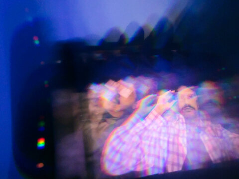 Prism distortion portrait of man with light reflections