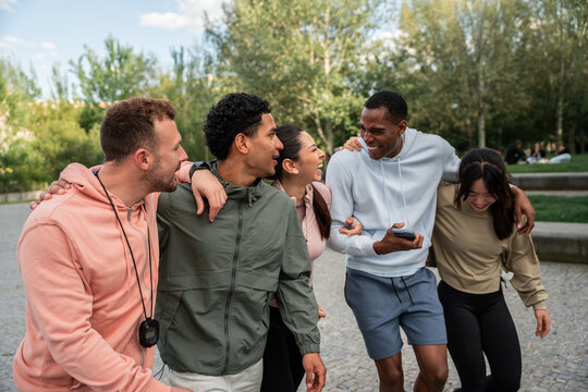 Friends walking together sharing laughter outdoors