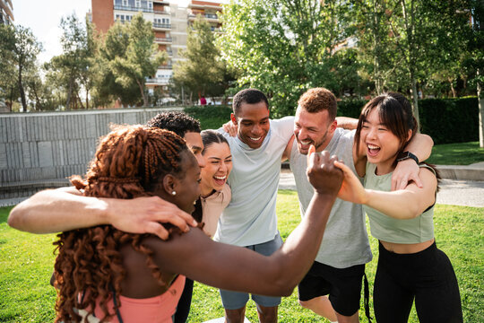Multicultural friends sharing a joyful moment outdoors