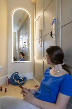 Teenager portrait mirror  mobile phone  in bedroom at Home 