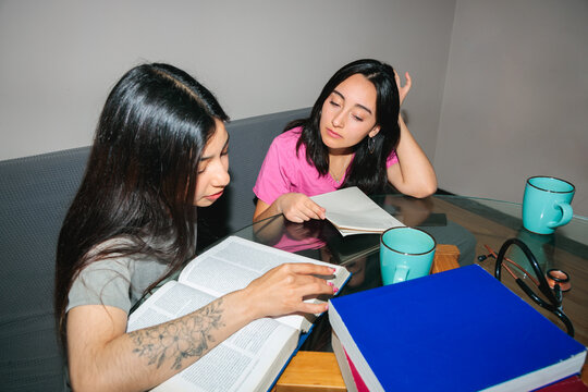 Students Studying Medical Textbook