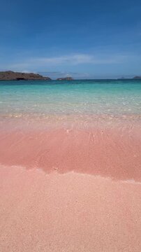 Beautiful Pink beach sea waves in a Comodo or Komodo National park, Indonesia