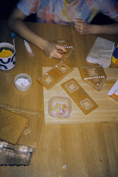 Assembling gingerbread house on Christmas 