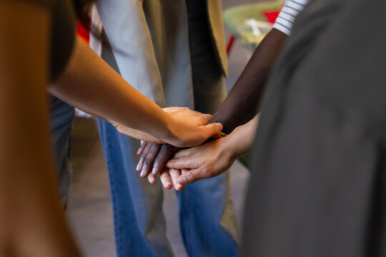 Teamwork and unity showcased in a collaborative gesture