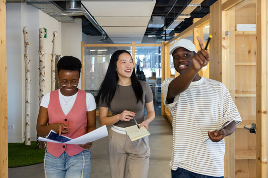 Collaborative team walking through modern office space