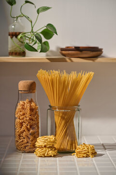 This image features a variety of pasta types on kitchen table