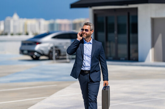 Busy businessman phone conversation. Confident businessman use phone. Business call. Busy businessman talking phone. Office worker talking on phone outdoor. Businessman talk on smartphone