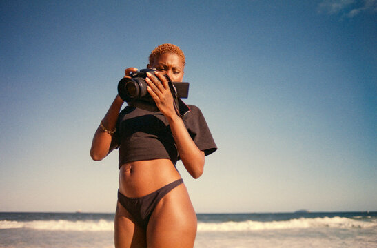 Checking Camera on Beach