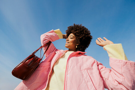 Smiling woman enjoying a sunny day outdoor