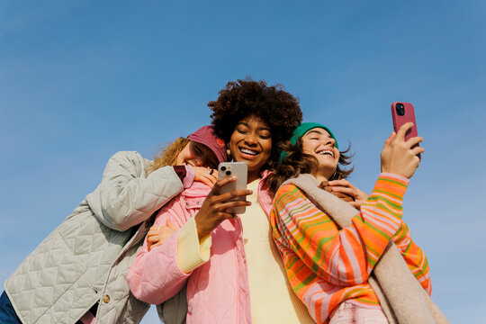 Diverse friends enjoying happy moments making a selfie