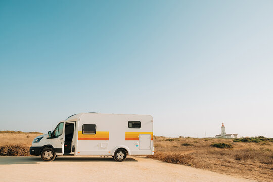 Camper Van Road Trip Near Coastal Lighthouse