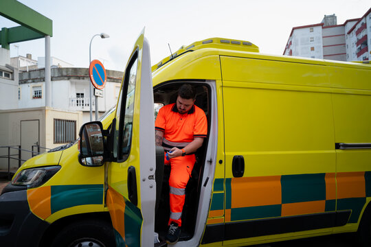 Paramedic Getting Out Of Ambulance