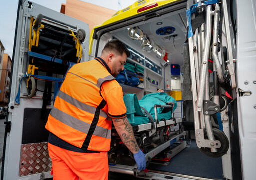 Paramedic Loading Patient Into Ambulance