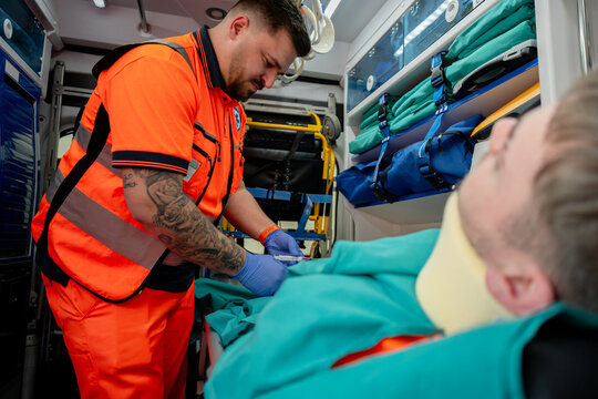 Paramedic Treating Patient Inside Ambulance
