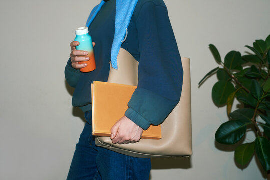 Woman holding everyday things