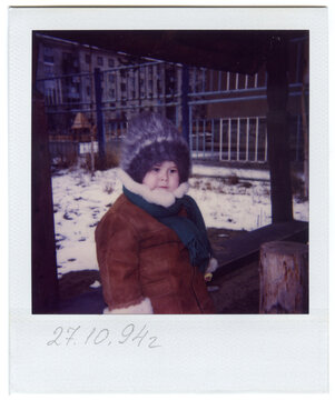 Vintage 1994 Polaroid of a Toddler on Snowy Playground 