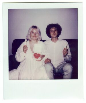 Vintage Polaroid of Newlyweds with Heart Cake on Wedding Night