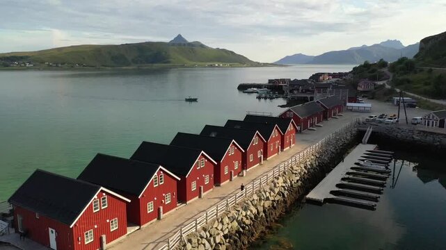 Aerial drone footage lofoten open landscape mountains golden grass norway