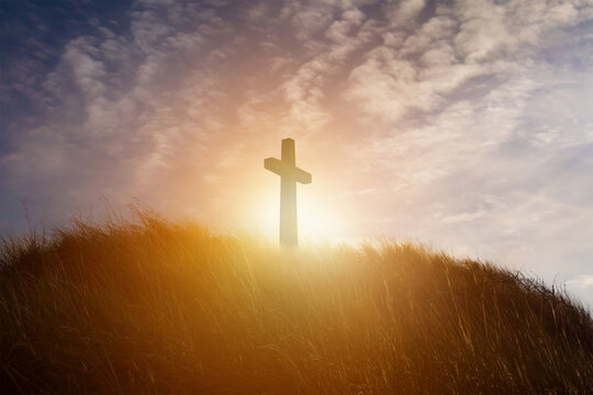 Christian crucifixion cross - Jesus Christ crucifix. Religious Christian worship symbol. Background associated with Easter and the holy resurrection. 