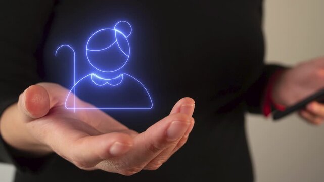 Woman's hand holding an icon of an older woman