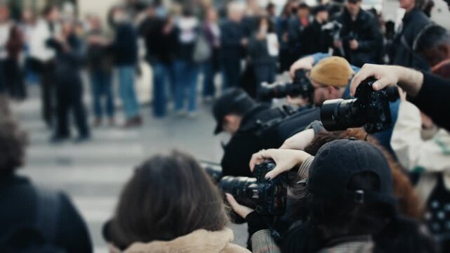 Photographers taking pictures during a public event