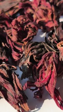 Dried rosella flowers with deep red tones, known for their natural health benefits, rich in antioxidants and commonly used to support immunity and overall wellness.