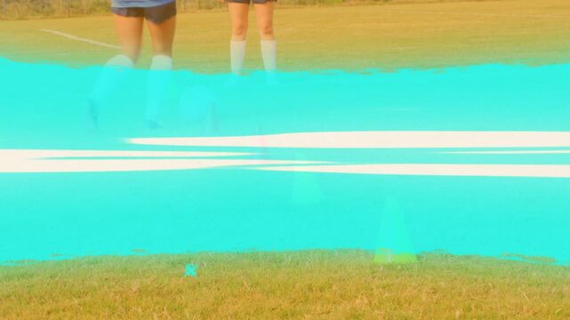 Player approaching cones, weaving white soccer ball training, turquoise wipe hiding feet, clearing