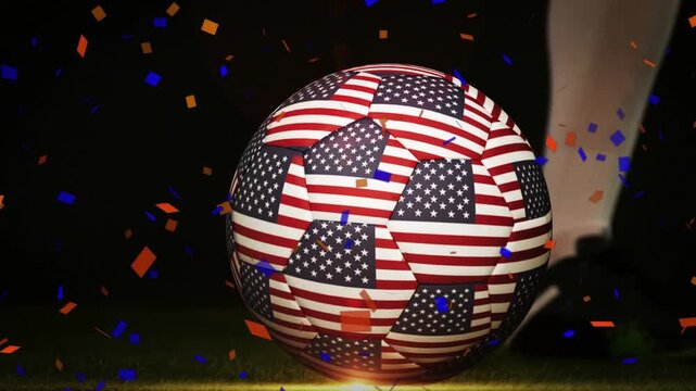 Player approaching, cleat kicking USA-flag soccer ball, sending ball rolling right, celebrating