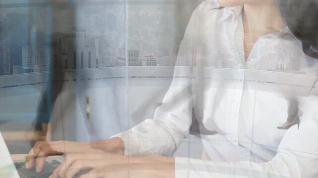 Office worker typing laptop, camera revealing city figures passing over her while handling business