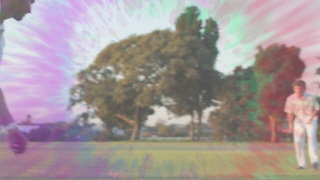 Cricket fielder diving, rolling, reaching, fielding red ball after bat hit, color overlay reacting