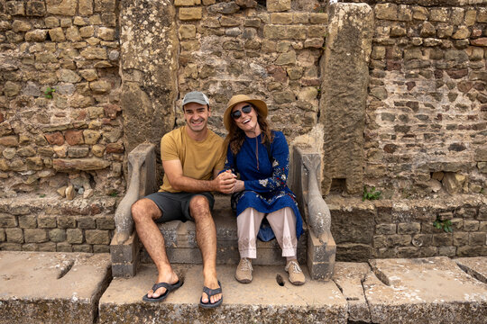 Roman public toilets with carved armrests and paired seating at Timgad
