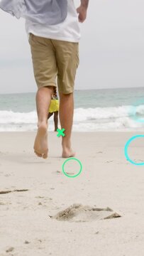 Vertical video: Man walking then running to sea, step causing teal graphics over prints for travel