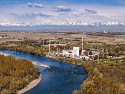 Aerial view of the Enrico Fermi Nuclear Power Plant and the Po River with the snow-capped Alps in the background Trino, Piemonte, Italy.