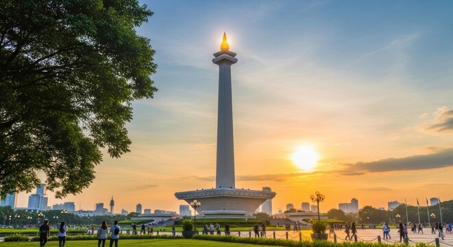 Monas National Monument in Jakarta at Sunset with Golden Sky and Lush Greenery.