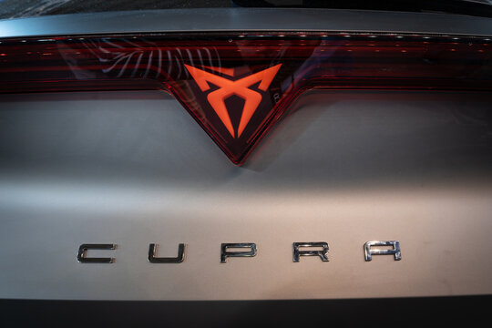 BELGRADE, SERBIA - MARCH 22, 2026: Cupra emblem and lettering on the rear section of a silver vehicle, part of Seat and Volkswagen, Cupra is an electric car manufacturer specialized in EV.