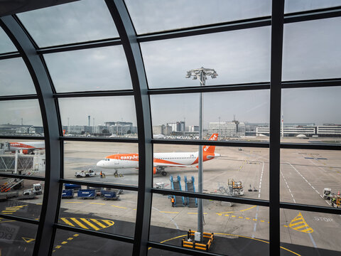 PARIS, FRANCE - MARCH 6, 2026: easyJet aircraft on the apronof Paris Charles de gaulle airport, with ground service vehicles, airport equipment. Easyjet is a European Low Cost Carrier Airline.