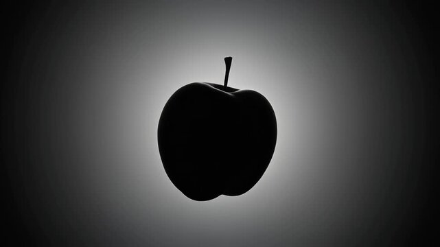 A stark black silhouette of a single apple centered against a dramatic radial grey gradient background, creating a minimalist and high-contrast composition.