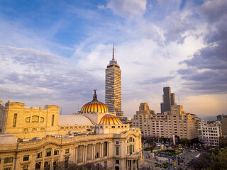Fototapeta premium Palacio de Bellas Artes and Torre Latinoamericana at golden hour in downtown Mexico City