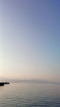 sunrise over the sea, island, mountains, time lapse