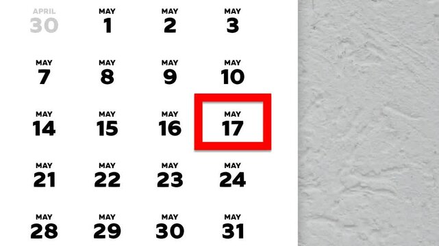 The date May 17th marked with a red cursor on the wall calendar 2026