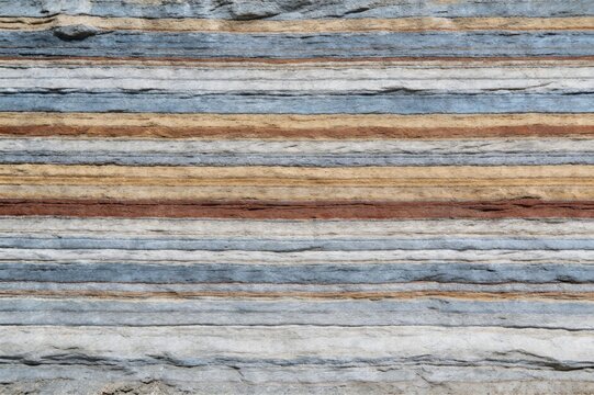 Vertical Archaeological View of Glacial Meltwater Sediment Varve Strata in Cool Earthy Tones

