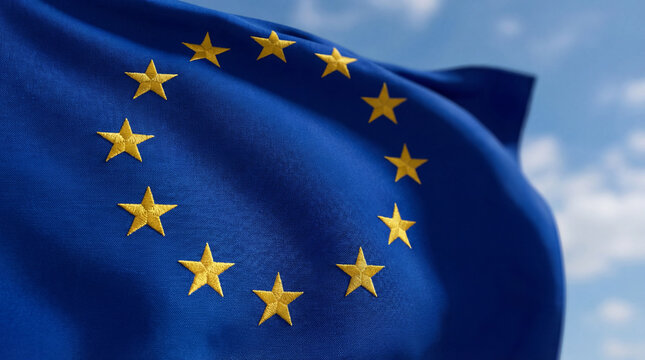 Europe Day EU flag waving in blue sky celebrates unity peace symbol freedom for editorial magazine article website banner header background patriotic content