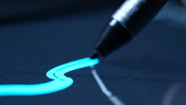 Digital Pen on a Tablet Drawing a Line