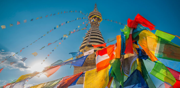 Spiritual Sunset at Swayambhunath Stupa with Colorful Prayer Flags and Copy Space