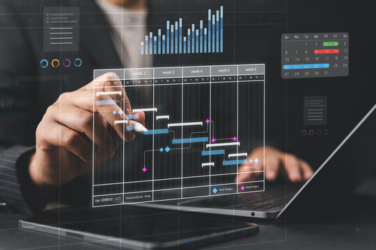 Project manager using stylus on tablet with hologram Gantt chart, representing business planning, timeline management, project scheduling, and efficient digital workflow strategy.