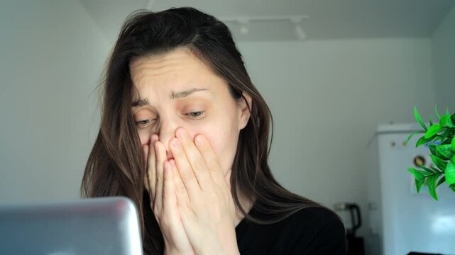 Lady reacts anxiously. Woman at residence feels alarmed. Female individual experiences shock and concern at house. Woman inside her dwelling exhibits surprise coupled with worry and fear