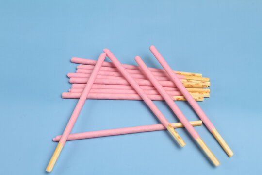 creamy biscuits stick on blue table