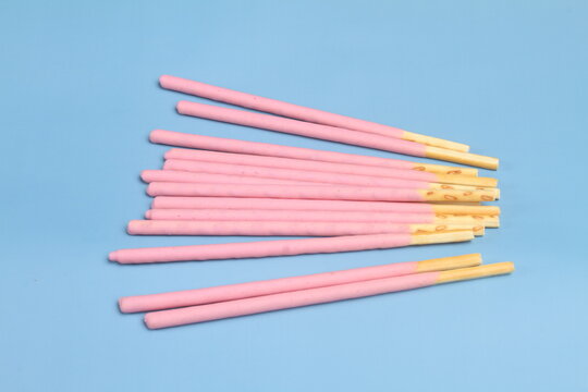 creamy biscuits stick on blue table