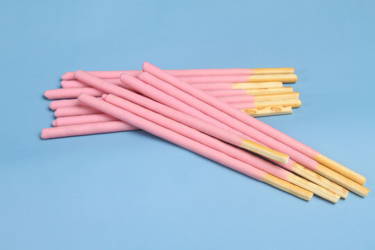 close up biscuits stick on blue background